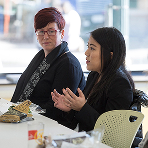 Person speaking up at meeting