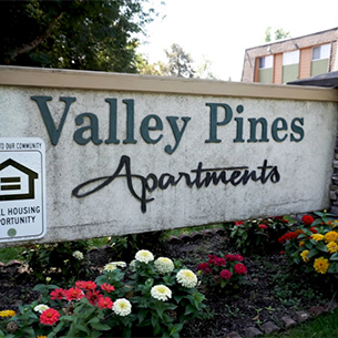 Subdivision sign reading Valley Pines Apartments
