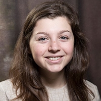 a young woman smiling at the camera