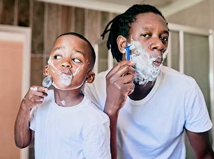 Dad and son shaving