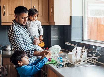 Family washing dishes