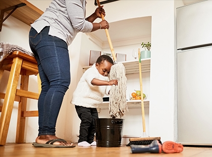 son helping mom mop