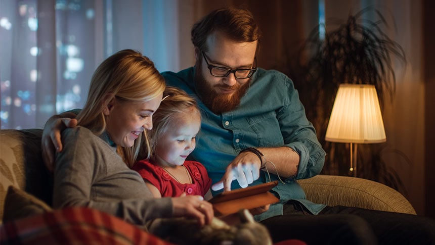 family looking at ipad