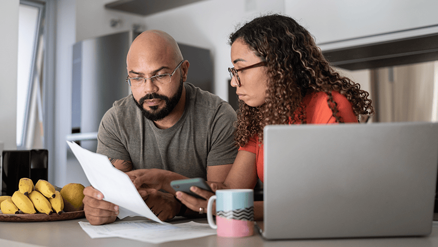 Couple reading paperwork